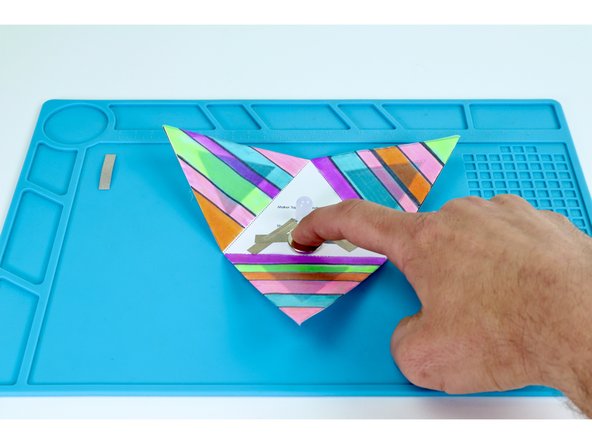 Place your battery positive (+) side UP atop the tape loop.