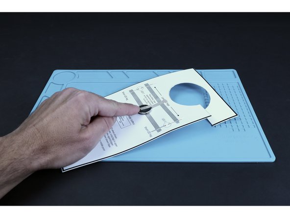 Peel and stick the final Maker Tape pathway where pictured. Sticking it to the top of the battery will turn the LEDs on the opposite side ON, while peeling it back will turn the LEDs OFF.