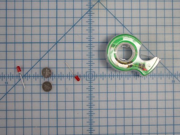 Take out your two red flashing LEDs, two batteries, and some tape.