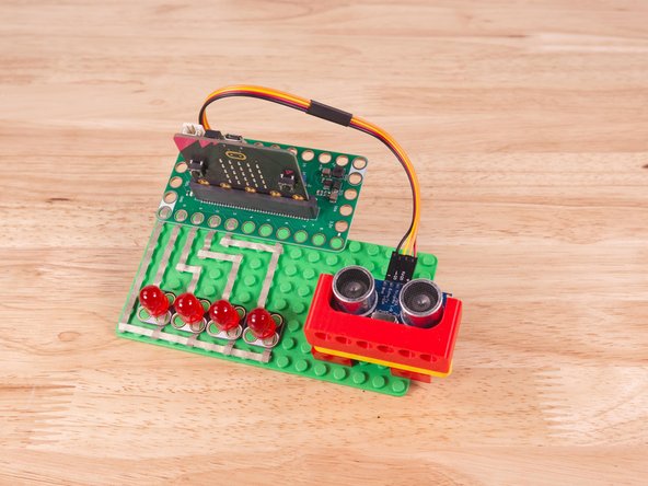 Alternately you can use some LEGO bricks and a rubber band or tape to hold the sensor in place. (But don't use anything conductive!)