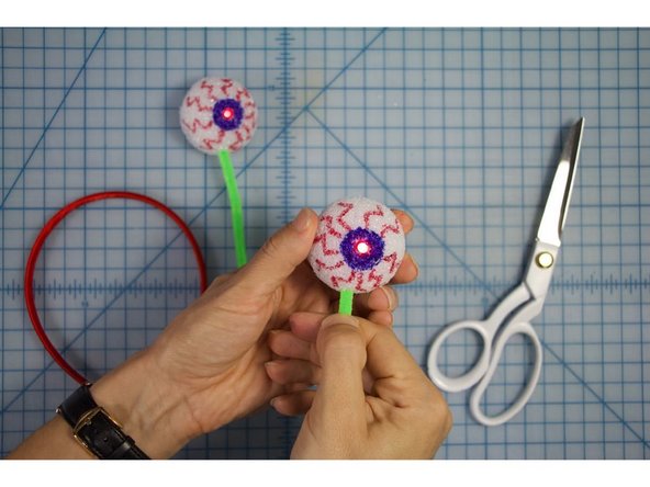 Insert the ends of the pipe cleaners into each of the styrofoam balls.