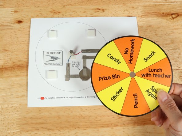 Place the wheel template of your choosing over the top of the motor so the motor goes through the small hole you cut earlier.