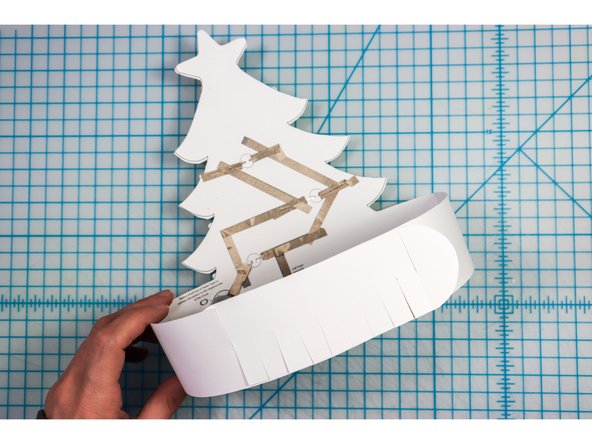 Interlock the slits in two places to create the size that works for your head.