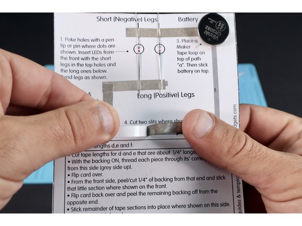 Flip card to back and peel the backing from the remainder of path &quot;d&quot;.  Stick into place where shown. Repeat the entire process you used for path &quot;d&quot; for path &quot;e&quot;.