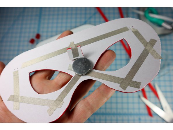 Place the loop on the Negative side of the battery as shown.