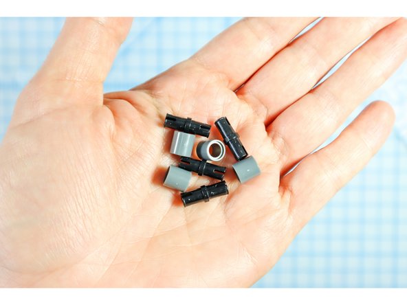 Connect each LEGO pin to a LEGO round beam as shown.