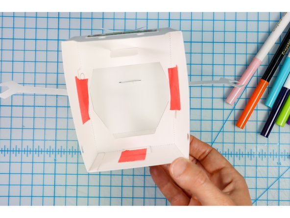 Place them at the angle that you like and then tape them in place. (You may need to trim them shorter so that they don't stick out of the neck.)