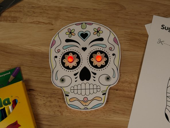 If it doesn't light up, check all your connections. Make sure to press down on the tape firmly where it connects to the LED legs.