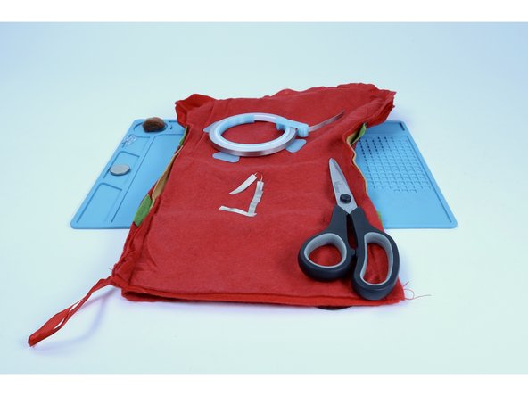 Cut and stick a new piece of Maker Tape as shown, connecting it to the shortest of the two LED legs back TOWARD the other (longer) leg. It should look a bit like an incomplete triangle.