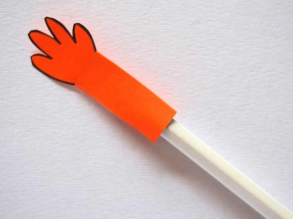 Use a pencil to open up the pocket in the arm. This will make it easier to slide it onto the LEGO axle mount.