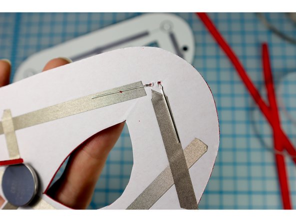 Make sure that the longer, Positive leg is facing the center of the mask.