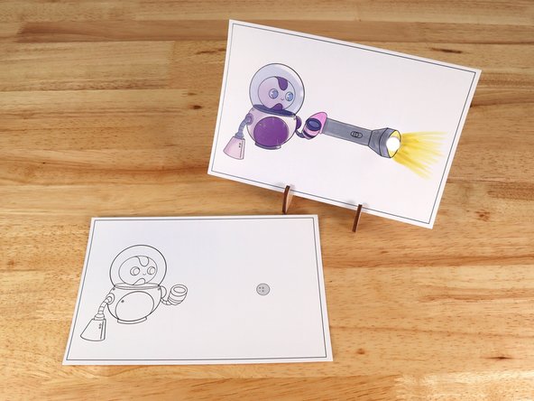 Poke holes through the front of the card for the LED legs, then push the legs through the front.