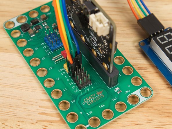 We'll add the 7 Segment Display by using four Female/Female jumper wires. Each pin of the display will connect to a pin on the Bit Board.