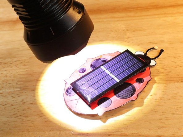 You do need to hold the LED flashlight very close to the solar panel, practically touching it, but if you hold the Solar Bug in your hand you will be able to feel it vibrating.