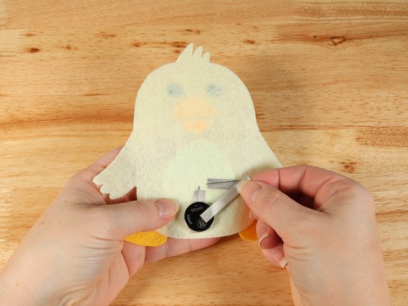 Add Maker Tape to connect the top (Positive) side of the battery to the Positive LED leg path.