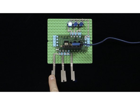 Once you've got your circuit complete and the micro:bit programmed and powered by a USB cable you should be able to touch the Maker Tape to see an LED turn on.