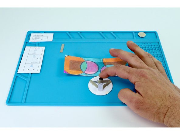 Place that tape loop atop the battery end of the tape path pictured in photo 3.