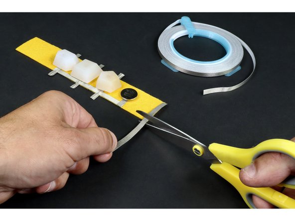 Measure and cut two Maker Tape paths that are the width of the felt.