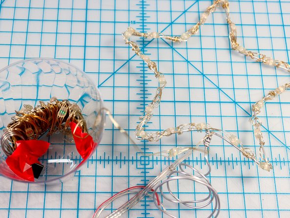 You could trim the NeoPixel strip and remove the unused pixels. However, since they could be unwrapped and reused, hiding the extra pixels inside the cup or in the tree gives you options for later!