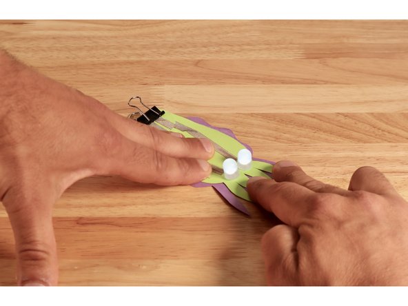 Press the top (circuit) portion to the bottom so that the ruffled edges and arms show.