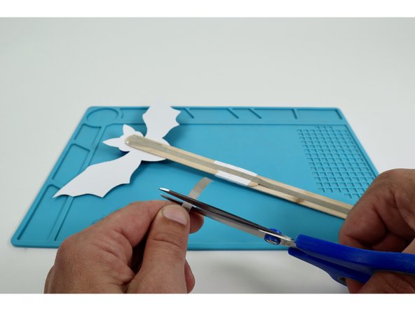 Cut a piece of Maker Tape and make one final sticky-side-out Maker Tape Loop.