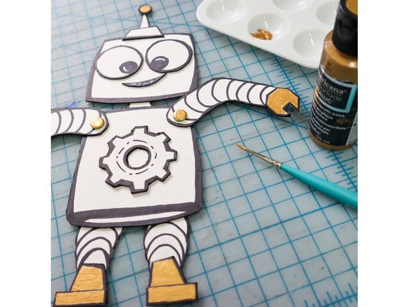 Paint or color in the accents. I used silver and gold paint in the example.