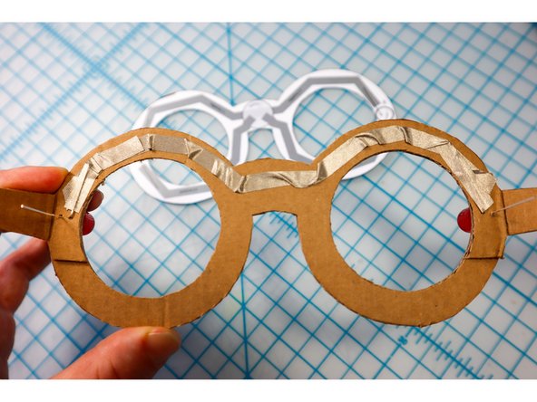 Secure them in place with another piece of Maker Tape on top as shown.