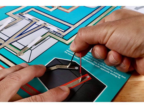 Measure, cut, peel, and stick Maker Tape paths shown in the first image. The Negative (-) Black Circle Path will bring electricity into the switch. The Positive (+) Red Circle Path will allow the current to return to the voltage source.