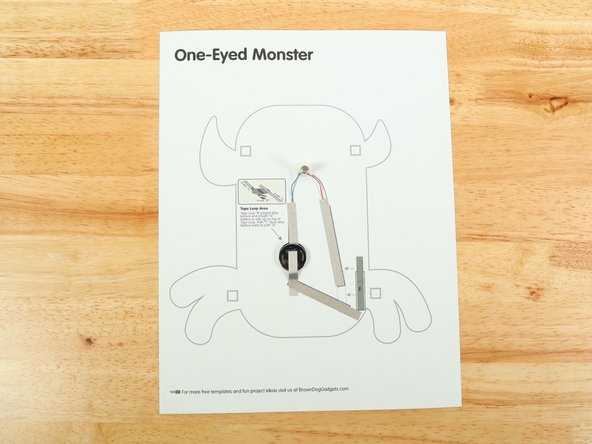 Add tape Path E. pressing it down atop the red wire.