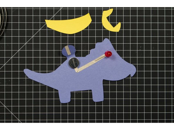 Place the battery so that bottom (negative) side is over the negative line of tape.