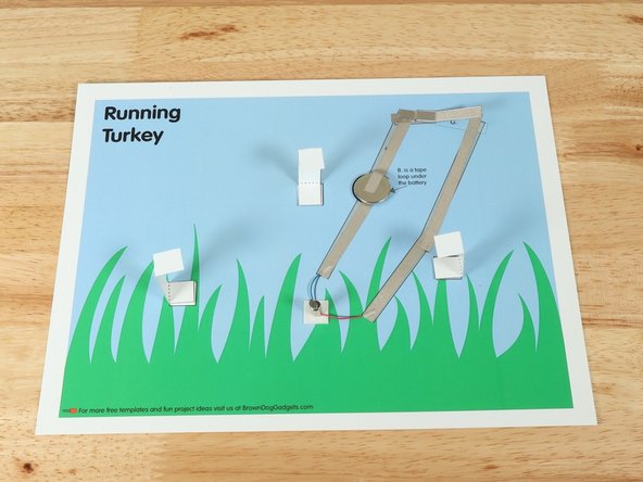 Place the standoffs on each of the pieces of foam tape so the inside of the C shape is facing toward the legs.