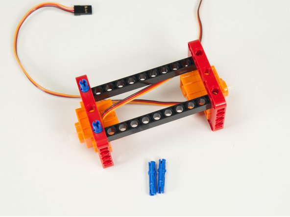 Use the long blue pins to hold the beams into place.