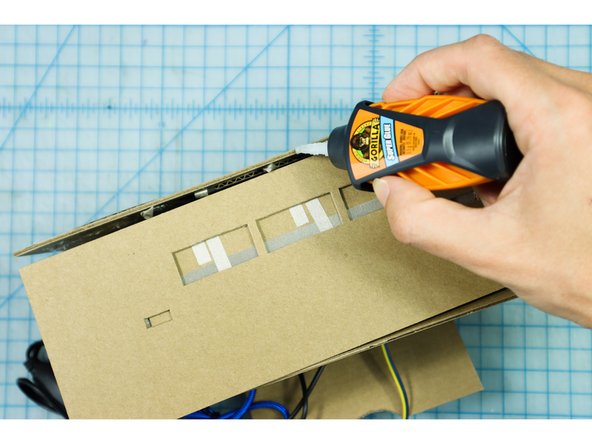 Glue the top of the box to the front and back with Super Glue