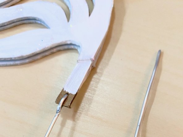 We attached the armature wire to the LEGO piece that goes on the servo and created a chain link connection to the wing wire.