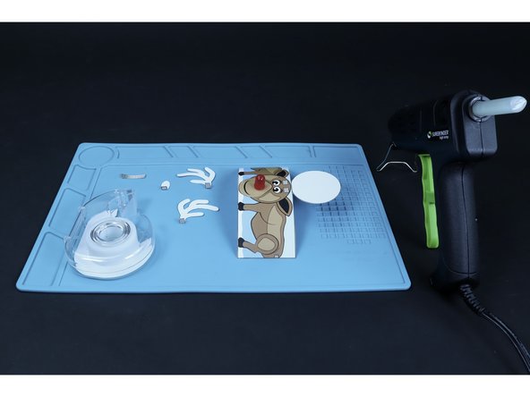 Fold the ends of the antlers and tail as shown where the striped portion meets the non-striped.