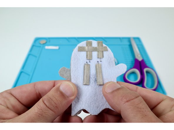 Peel and stick the three Maker Tape paths you cut in the previous guide step as shown in the photos at left. 