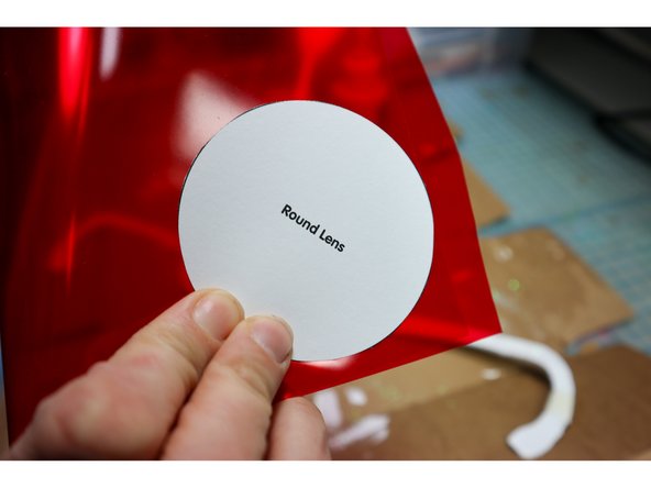 Use hot glue to glue them to the back of the frames.