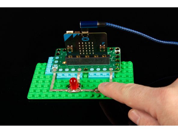 When you start the LED should be off. If you press the button once it should turn on, then if you press the button again it should turn off.