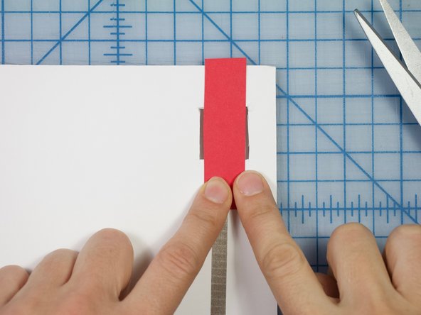 Fold the strip so that it sits inside as shown.