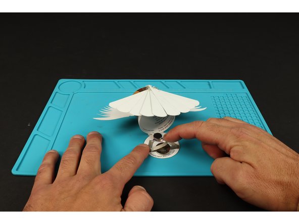 Add the final piece of Maker Tape and fold the lid down to seal the deal! Note: Connecting this final piece of Maker Tape to the top of the battery turns the motor on. Peeling it back will turn it off.