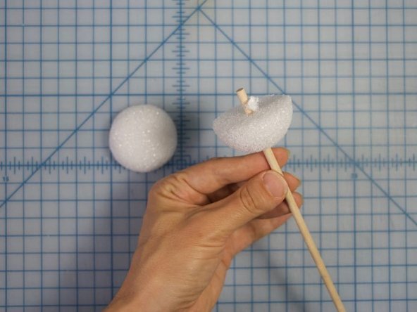 Use a dowel or another type of round stick (like a pencil) to make a hole in the center of each eye.