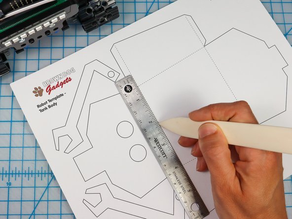 Use a bone folder or pen to score along the dotted red lines to make it easier to fold later.