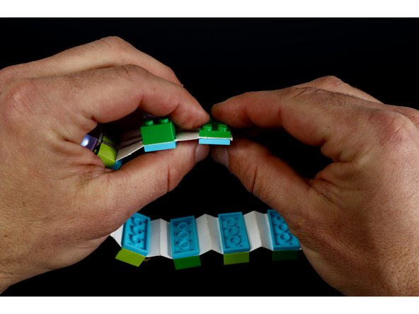 To create the LEGO clasp/closure. You will need to focus attention on those last two punched rectangles at the opposite ends of your bracelet.