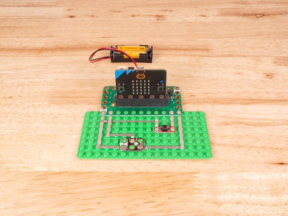 We'll connect our Button to Pin 8 and to Ground (GND) BUT! We're going to use the &quot;gutter&quot; between the LEGO baseplate studs so we can have two layers of tape that do not touch.