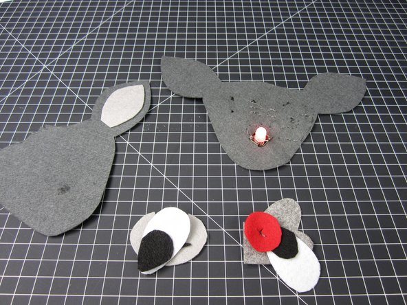 Add on all the other face embellishments. Fabric glue, got glue, or regular thread all work just fine.