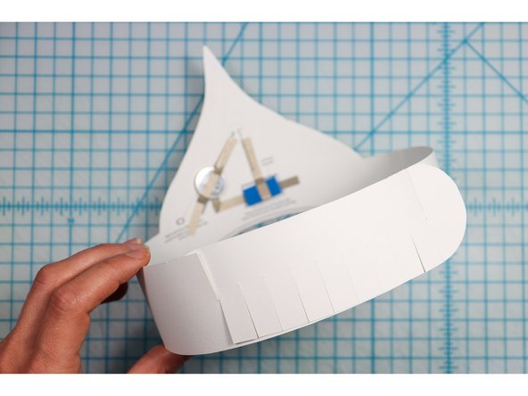 Interlock the slits in two places to create the size that works for your head. 