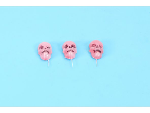 The LED legs will be sticking straight out of the back of the newly molded object. Identify all the short legs and bend them upward toward the top of the molded object (this means that they should be laying flat against the back of the hardened hot glue). Now bend the longer legs in the opposite direction.