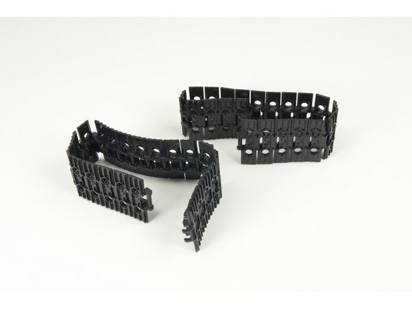 Once you have your two tracks assembled, place them parallel to each other for wrapping around the sprockets.