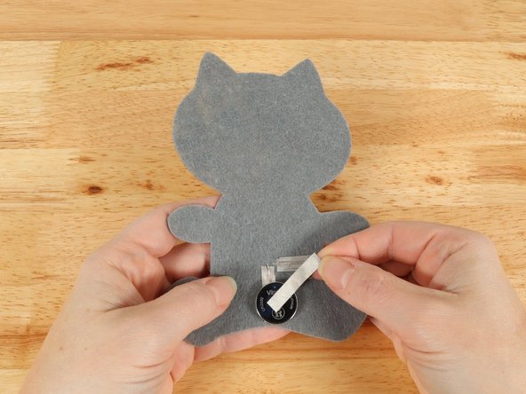 Add Maker Tape to connect the top (Positive) side of the battery to the Positive LED leg path.