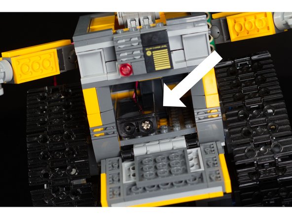 There is enough room in WALL-E's compartment to store an AAA battery pack.